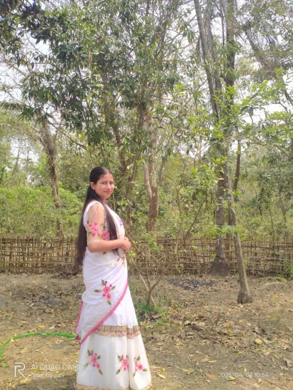Hand-Embroidered White Saree with Pink Floral and Tassel Design